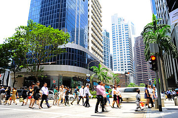 People crossing the street in a downtown